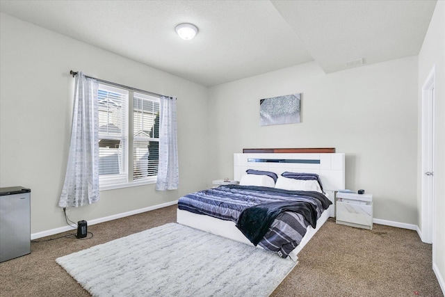 412 Doisy Ln, Champaign, IL 61822 - carpeted bedroom with baseboards and freestanding refrigerator