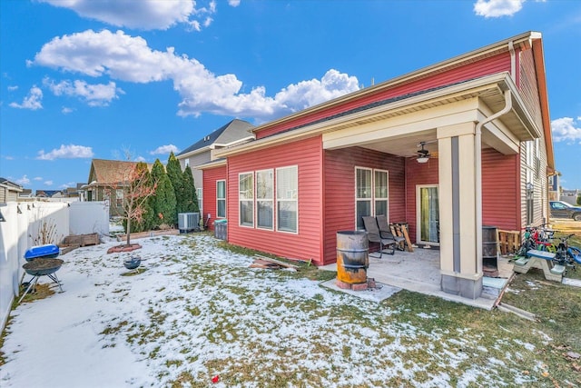 412 Doisy Ln, Champaign, IL 61822 - snow covered rear of property with a ceiling fan and a patio