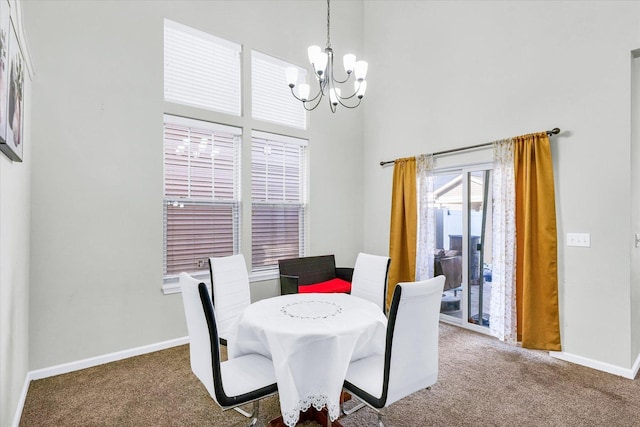 412 Doisy Ln, Champaign, IL 61822 - dining area featuring a chandelier, carpet, and a towering ceiling