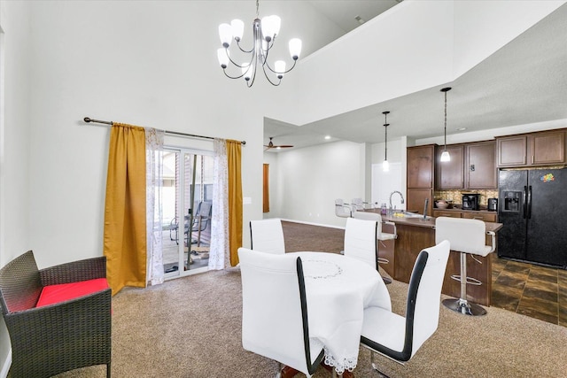 412 Doisy Ln, Champaign, IL 61822 - dining area with dark carpet, a chandelier, and a high ceiling