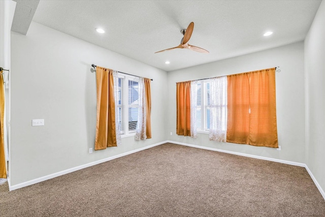 412 Doisy Ln, Champaign, IL 61822 - empty room with carpet, ceiling fan, recessed lighting, and a textured ceiling