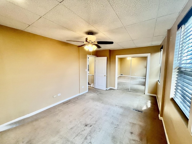 2948 E 95th St, Chicago, IL 60617 - unfurnished bedroom with a drop ceiling, a closet, and a ceiling fan