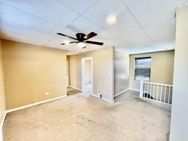 2948 E 95th St, Chicago, IL 60617 - spare room with a paneled ceiling, ceiling fan, and carpet flooring
