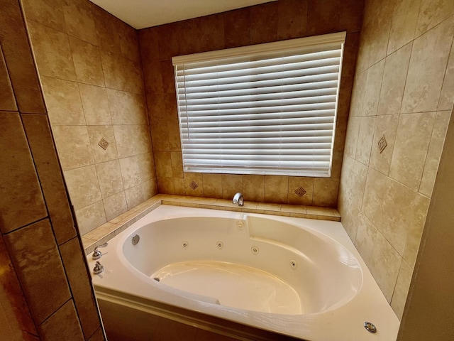 2948 E 95th St, Chicago, IL 60617 - bathroom featuring a tub with jets and tile walls
