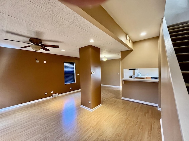 2948 E 95th St, Chicago, IL 60617 - unfurnished living room featuring light wood-style floors, a ceiling fan, stairs, and recessed lighting