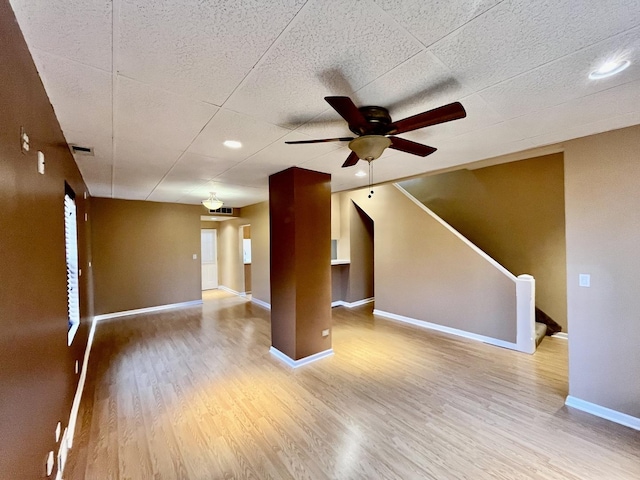 2948 E 95th St, Chicago, IL 60617 - unfurnished living room featuring a ceiling fan, wood finished floors, stairs, and recessed lighting