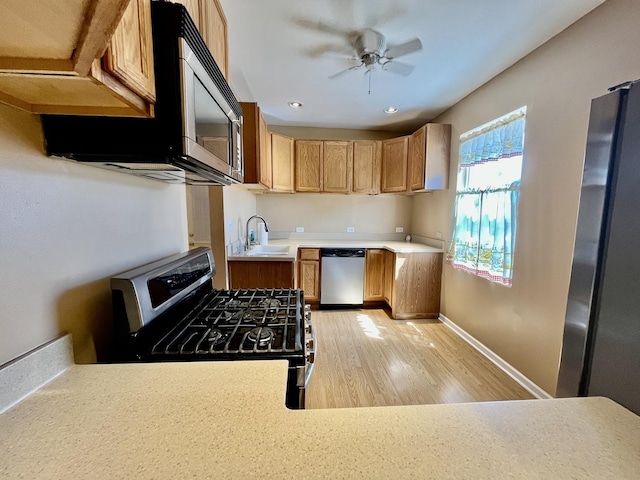 2948 E 95th St, Chicago, IL 60617 - kitchen with stainless steel appliances, light countertops, a ceiling fan, light wood-type flooring, and recessed lighting