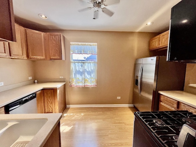 2948 E 95th St, Chicago, IL 60617 - kitchen with appliances with stainless steel finishes, light wood finished floors, ceiling fan, light countertops, and recessed lighting