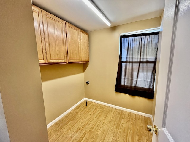 2948 E 95th St, Chicago, IL 60617 - washroom with light wood-style floors, cabinet space, and electric dryer hookup