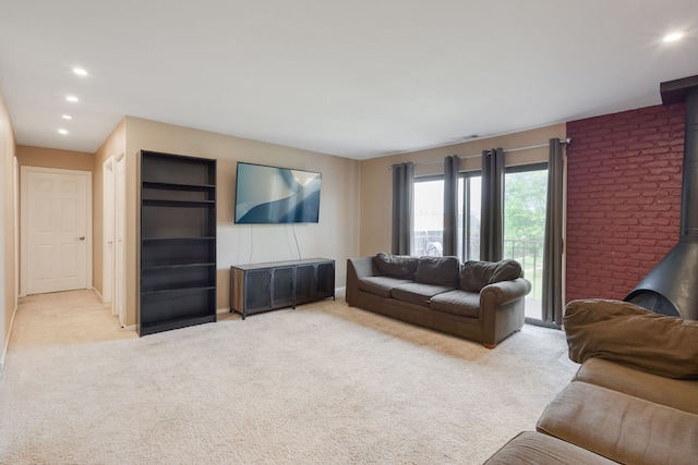 717 Tipperary Ct Unit 2B, Schaumburg, IL 60193 - living area with a wood stove, light carpet, and recessed lighting