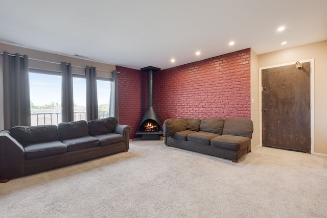 717 Tipperary Ct Unit 2B, Schaumburg, IL 60193 - carpeted living room featuring recessed lighting, a wood stove, and brick wall