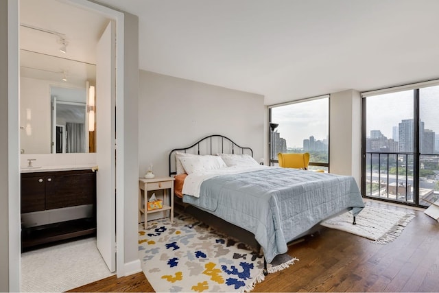 345 W Fullerton Pkwy Unit 1706, Chicago, IL 60614 - bedroom with wood finished floors, multiple windows, a view of skyline, access to outside, and a wall of windows