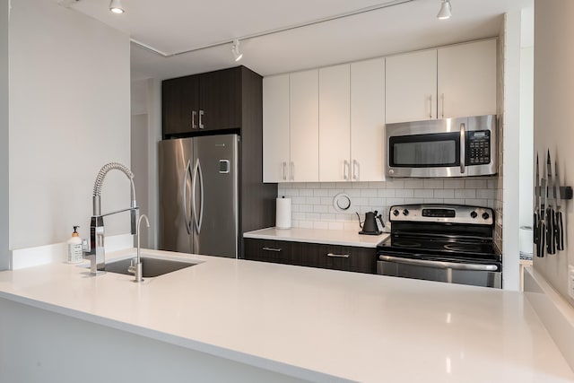 345 W Fullerton Pkwy Unit 1706, Chicago, IL 60614 - kitchen with appliances with stainless steel finishes, track lighting, and light countertops