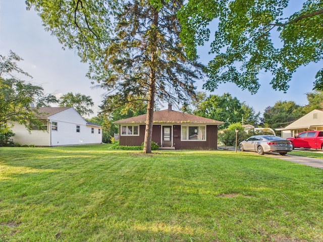 2404 Sigwalt St, Rolling Meadows, IL 60008 - ranch-style home with a front yard and a chimney