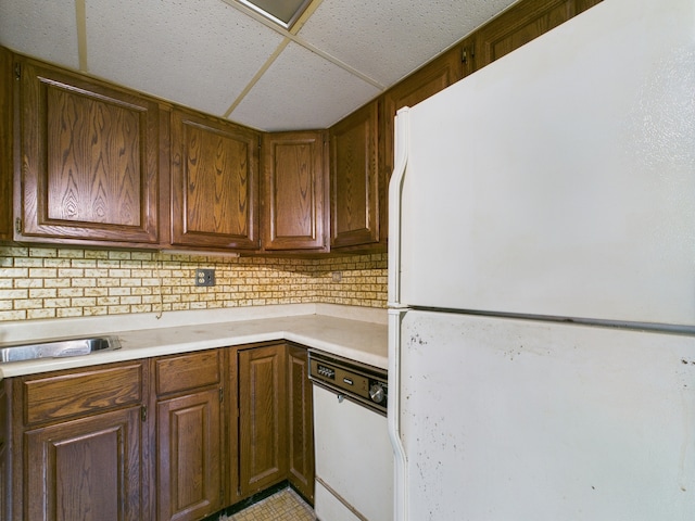 2404 Sigwalt St, Rolling Meadows, IL 60008 - kitchen featuring white appliances, light countertops, backsplash, and a drop ceiling