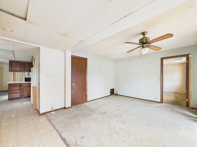 2404 Sigwalt St, Rolling Meadows, IL 60008 - unfurnished living room with a drop ceiling and a ceiling fan