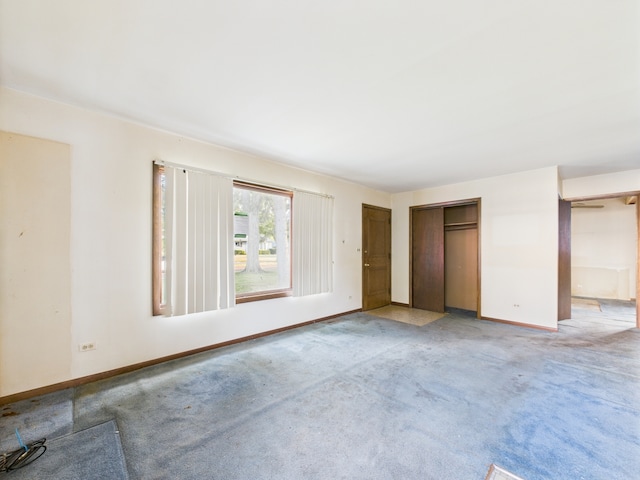 2404 Sigwalt St, Rolling Meadows, IL 60008 - unfurnished bedroom with baseboards and light carpet