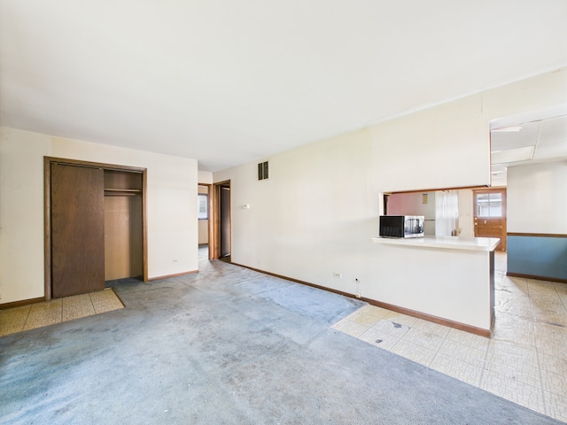 2404 Sigwalt St, Rolling Meadows, IL 60008 - unfurnished living room featuring baseboards