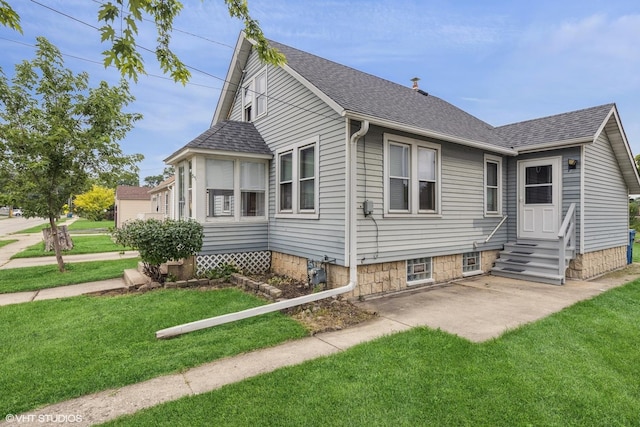 527 W Green St, Bensenville, IL 60106 - view of side of property featuring entry steps, roof with shingles, a yard, and a patio