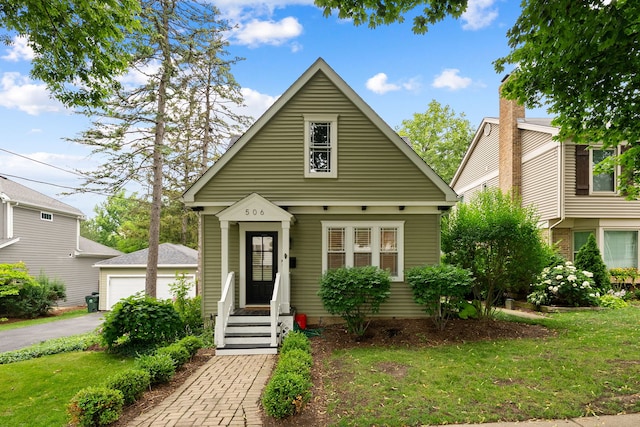 506 E Russell St, Barrington, IL 60010 - view of front of house with a front lawn and a garage
