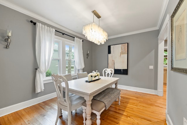 506 E Russell St, Barrington, IL 60010 - dining space with plenty of natural light, a chandelier, light wood-type flooring, and crown molding