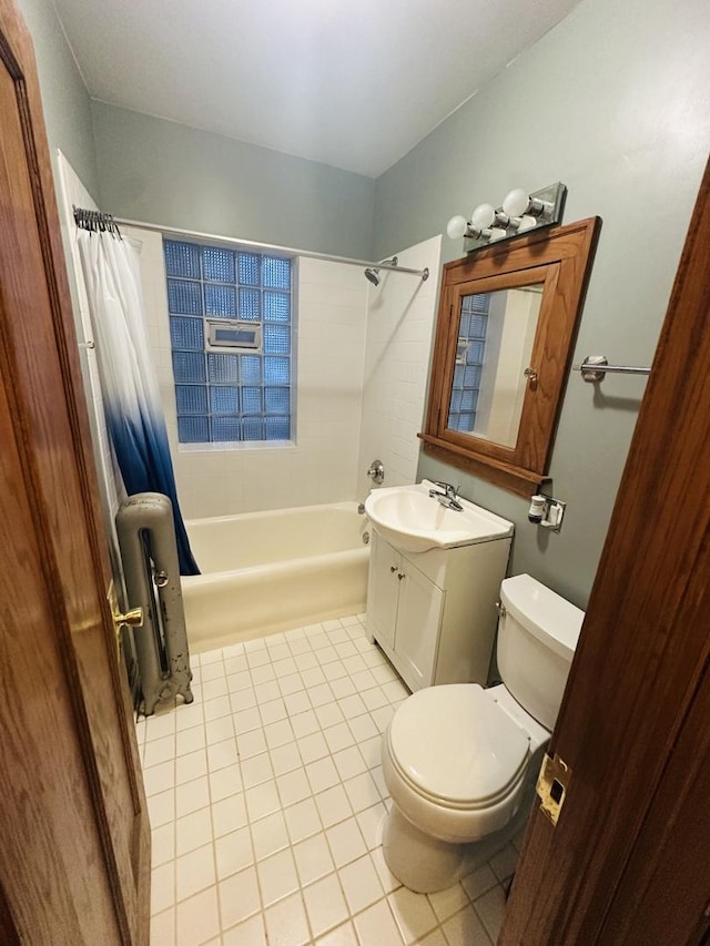 3514 N Lawndale Ave Unit 2, Chicago, IL 60618 - full bathroom featuring tile patterned floors, shower / tub combo, vanity, and radiator heating unit