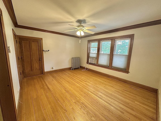 3514 N Lawndale Ave Unit 2, Chicago, IL 60618 - spare room featuring radiator heating unit, light wood-type flooring, ornamental molding, a ceiling fan, and cooling unit