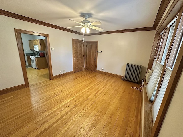 3514 N Lawndale Ave Unit 2, Chicago, IL 60618 - unfurnished bedroom with radiator, light wood-style flooring, ornamental molding, a ceiling fan, and a closet