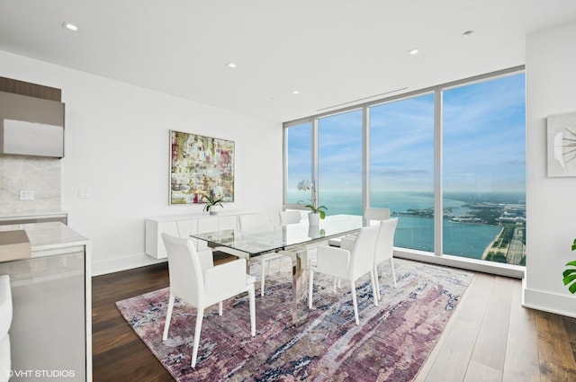 363 E Wacker Dr Unit 6501, Chicago, IL 60601 - dining room with dark wood-style floors, floor to ceiling windows, a water view, and recessed lighting