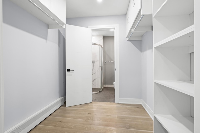974 Crabapple Dr Unit 308, Prospect Heights, IL 60070 - spacious closet with a baseboard radiator and light wood-style flooring