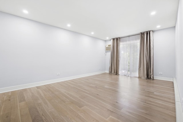 974 Crabapple Dr Unit 308, Prospect Heights, IL 60070 - empty room with light wood finished floors, recessed lighting, and an AC wall unit