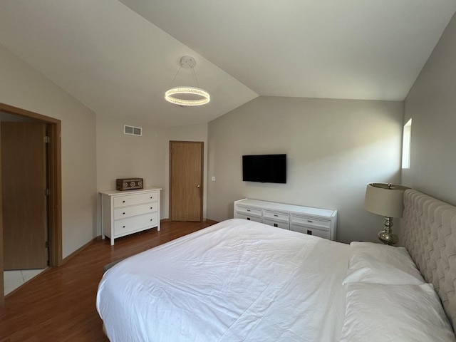 163 Mountain Laurel Ct, Romeoville, IL 60446 - bedroom featuring vaulted ceiling and dark wood-style flooring