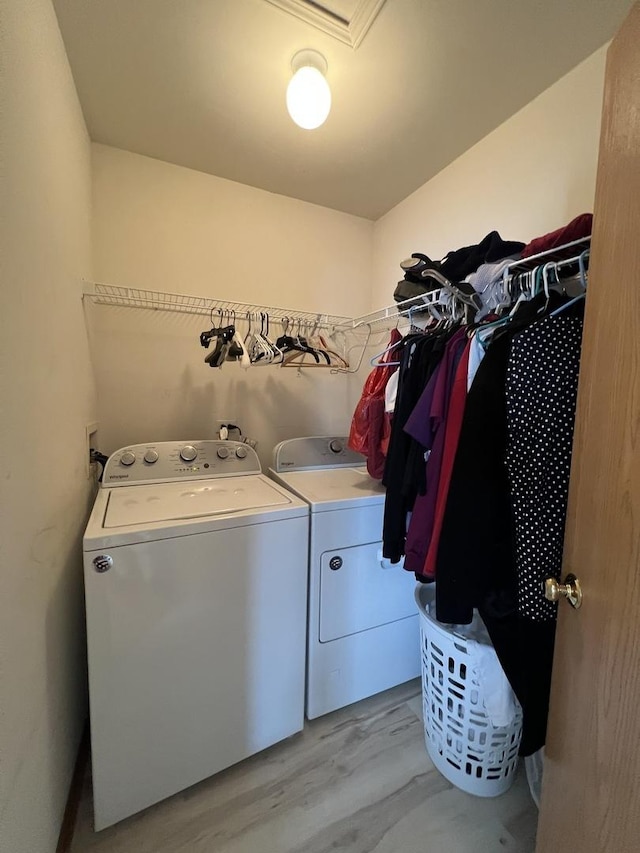 163 Mountain Laurel Ct, Romeoville, IL 60446 - washroom with washing machine and clothes dryer and light wood-style floors