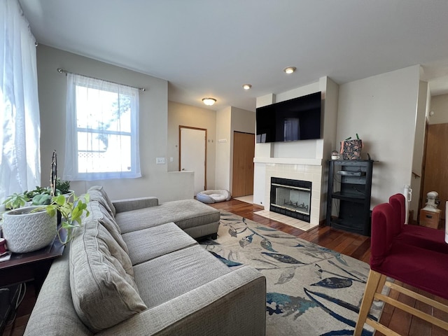 163 Mountain Laurel Ct, Romeoville, IL 60446 - living area with wood finished floors, a tile fireplace, and recessed lighting