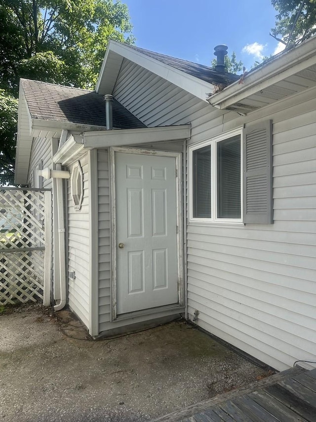 201 E N St, Saybrook, IL 61770 - view of exterior entry featuring a shingled roof
