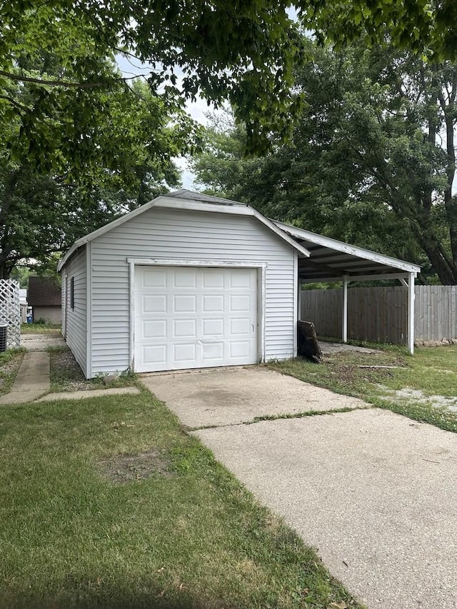 201 E N St, Saybrook, IL 61770 - garage featuring a garage and concrete driveway