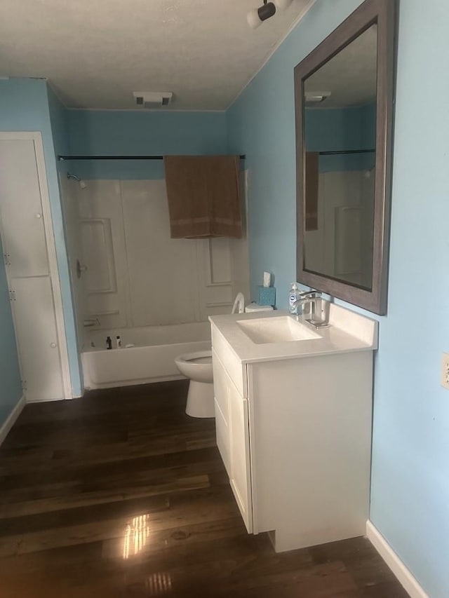 201 E N St, Saybrook, IL 61770 - bathroom with vanity, wood finished floors, and bathing tub / shower combination