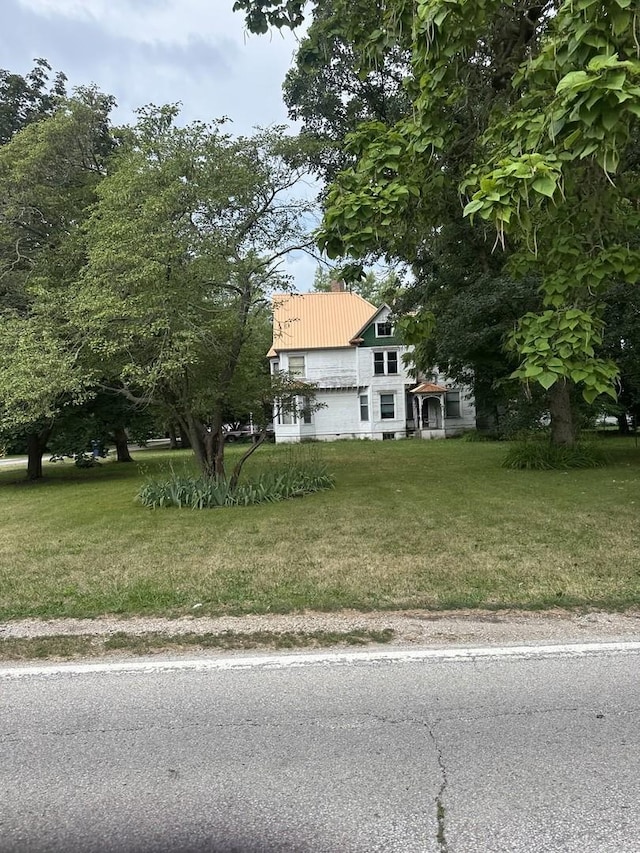 201 E N St, Saybrook, IL 61770 - view of front of property with a front yard and a metal roof