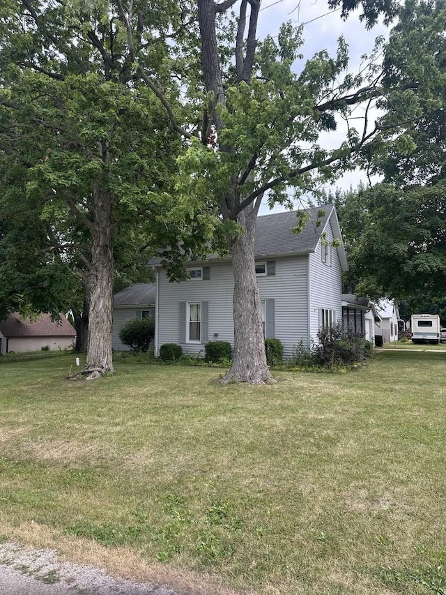 201 E N St, Saybrook, IL 61770 - view of side of home featuring a yard