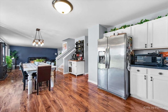 243 Johnson St, Hampshire, IL 60140 - dining area featuring dark wood-style flooring, stairs, and a chandelier
