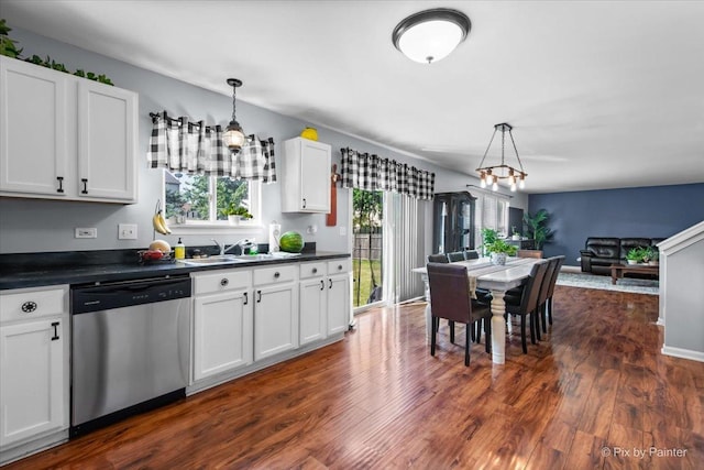 243 Johnson St, Hampshire, IL 60140 - kitchen with stainless steel dishwasher, dark countertops, pendant lighting, and white cabinets