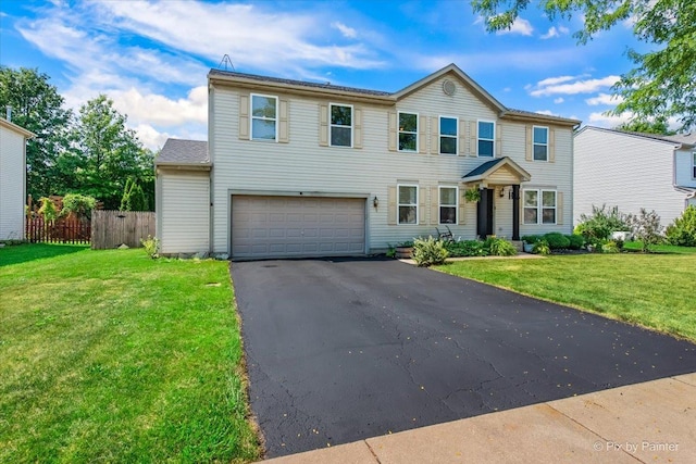 243 Johnson St, Hampshire, IL 60140 - view of front of home featuring an attached garage and asphalt driveway