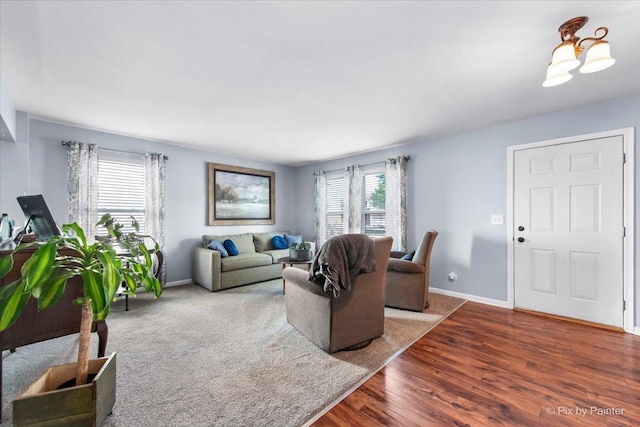 243 Johnson St, Hampshire, IL 60140 - living room featuring baseboards and wood finished floors