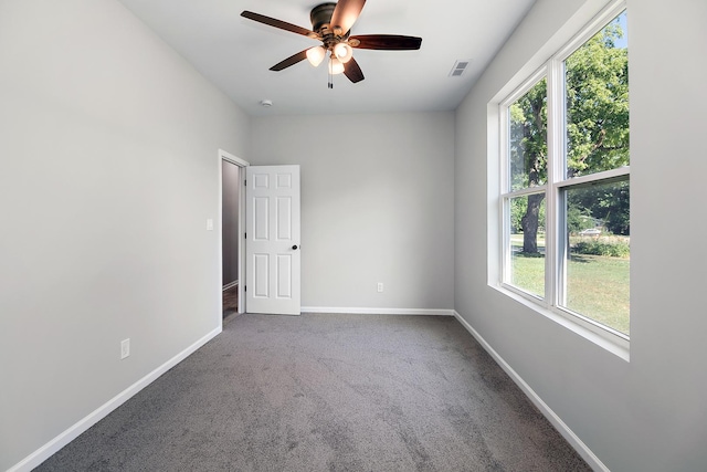 121 Pine St, Buckingham, IL 60917 - empty room with carpet flooring, a ceiling fan, and a smoke detector