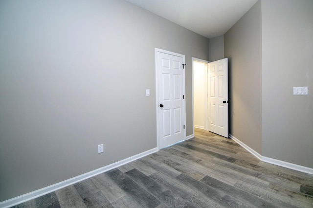 121 Pine St, Buckingham, IL 60917 - unfurnished bedroom with wood finished floors and baseboards