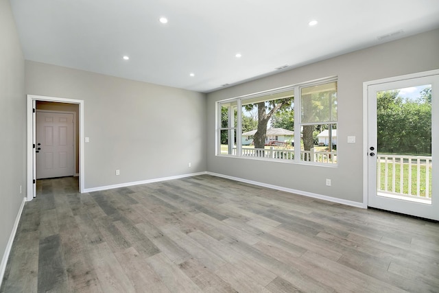 121 Pine St, Buckingham, IL 60917 - empty room with wood finished floors and recessed lighting