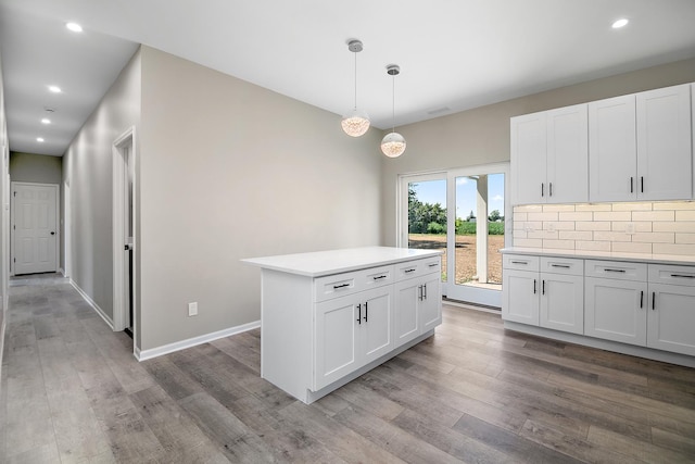 121 Pine St, Buckingham, IL 60917 - kitchen featuring wood finished floors, light countertops, white cabinets, and recessed lighting