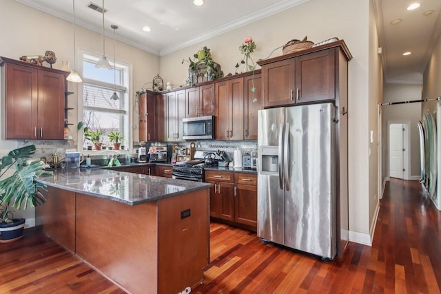 3234 N California St Unit 3S, Chicago, IL 60618 - kitchen featuring appliances with stainless steel finishes, a peninsula, dark stone counters, crown molding, and dark wood finished floors