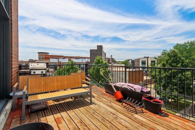 3234 N California St Unit 3S, Chicago, IL 60618 - wooden terrace with a grill