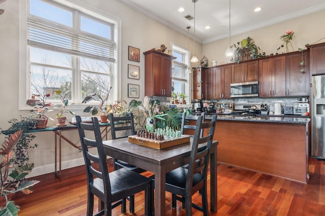 3234 N California St Unit 3S, Chicago, IL 60618 - dining space with ornamental molding, plenty of natural light, wood finished floors, and recessed lighting